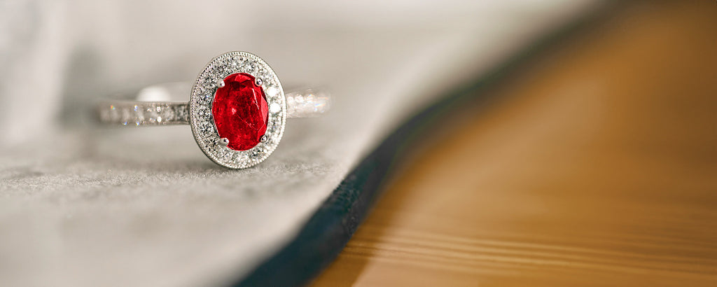 ruby ring with diamond halo and shoulders